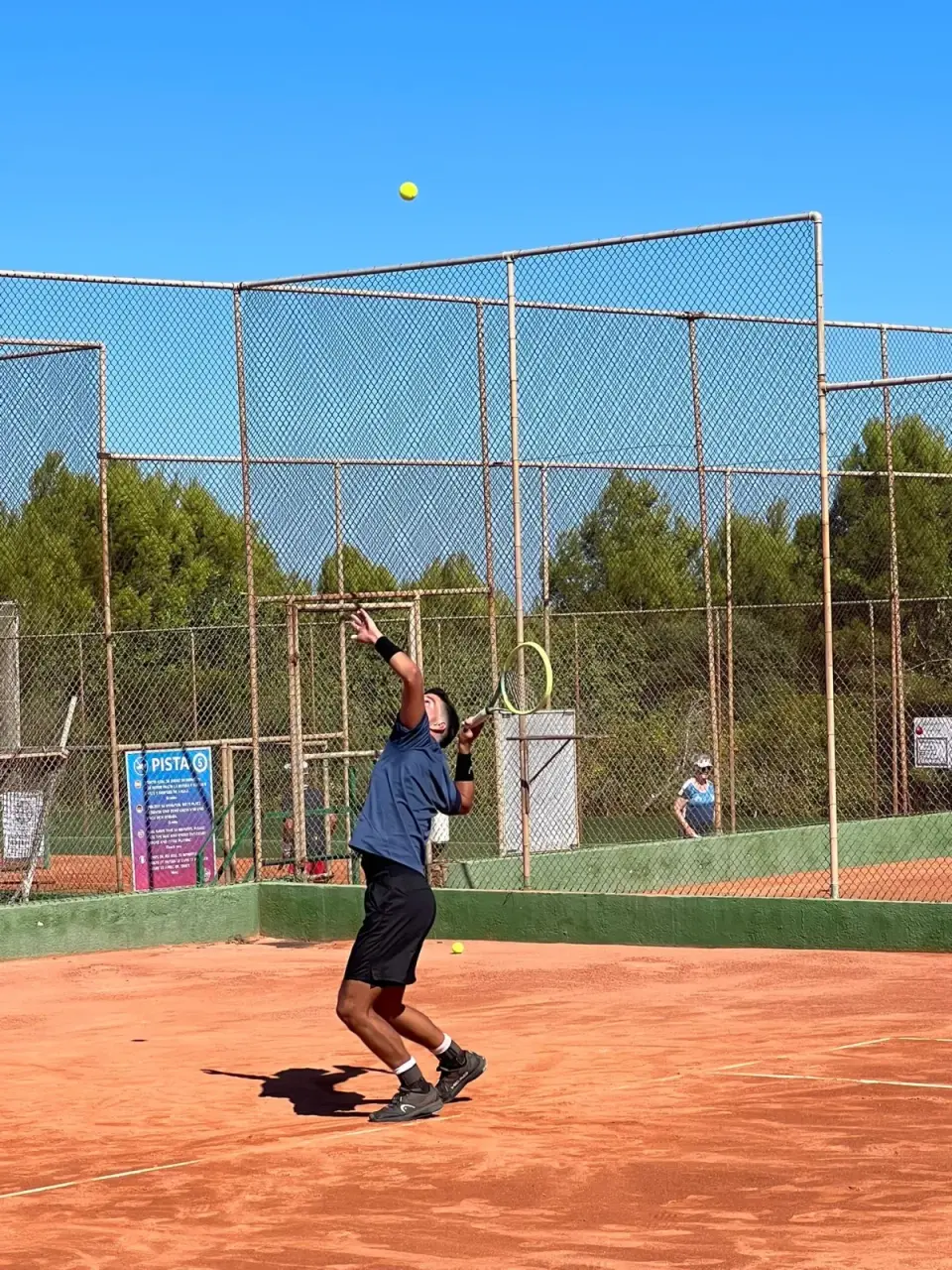 Tennis player on court during a match.
